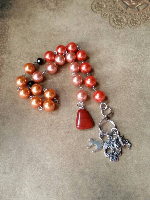 Samhain prayer beads, pagan prayer beads, Samhain witches prayer beads, stainless steel, glass pearls, Red Jasper, three spooky charms