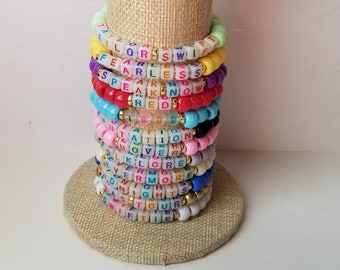 Sets of 12 friendship bracelets, beaded Swiftie bracelets, Eras themed friendship bracelets, stretchy bracelets, swappable concert bracelets