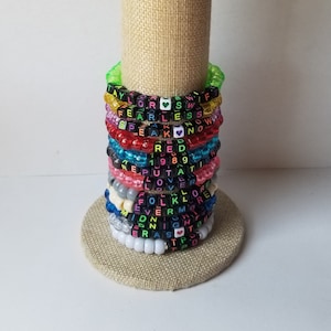Sets of 12 friendship bracelets, beaded Swiftie bracelets, Eras themed friendship bracelets, stretchy bracelets, swappable concert bracelets