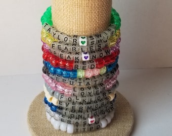 Sets von 12 Freundschaftsbändern, Perlen T Swift Armbänder, Eras Tour Freundschaftsbänder, austauschbare Konzertbänder, einschließlich TTPD