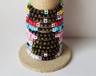 Sets of 12 friendship bracelets, beaded Swiftie bracelets, Eras themed friendship bracelets, stretchy bracelets, swappable concert bracelets