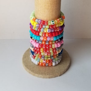 Sets of 12 friendship bracelets, beaded Swiftie bracelets, Eras themed friendship bracelets, stretchy bracelets, swappable concert bracelets
