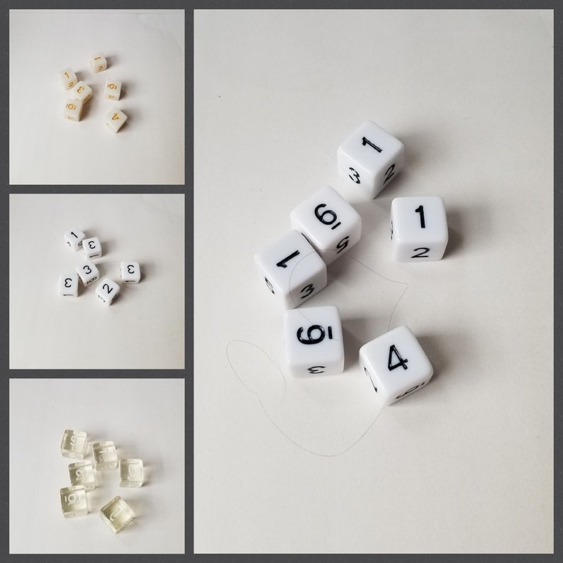 May include: A collection of white dice with black numbers. The dice are scattered on a white surface. The numbers on the dice are 1, 2, 3, 4, 5, and 6.