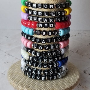 Sets of 12 friendship bracelets, beaded Swiftie bracelets, Eras themed friendship bracelets, stretchy bracelets, swappable concert bracelets