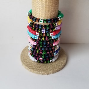 Sets of 12 friendship bracelets, beaded Swiftie bracelets, Eras themed friendship bracelets, stretchy bracelets, swappable concert bracelets