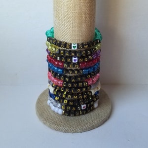 Sets of 12 friendship bracelets, beaded Swiftie bracelets, Eras themed friendship bracelets, stretchy bracelets, swappable concert bracelets