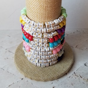 Sets of 10 friendship bracelets, beaded Swiftie bracelets, Eras themed friendship bracelets, stretchy bracelets, swappable concert bracelets