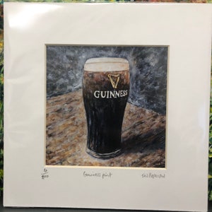 May include: A painting of a glass of Guinness beer on a wooden table. The glass is frosted and has the Guinness logo on it. The painting is signed "Ted Hepworth" and numbered "4/200".