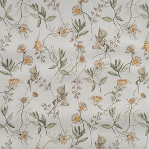 May include: A seamless pattern featuring a repeating design of small white and yellow flowers with green leaves on a light gray background.