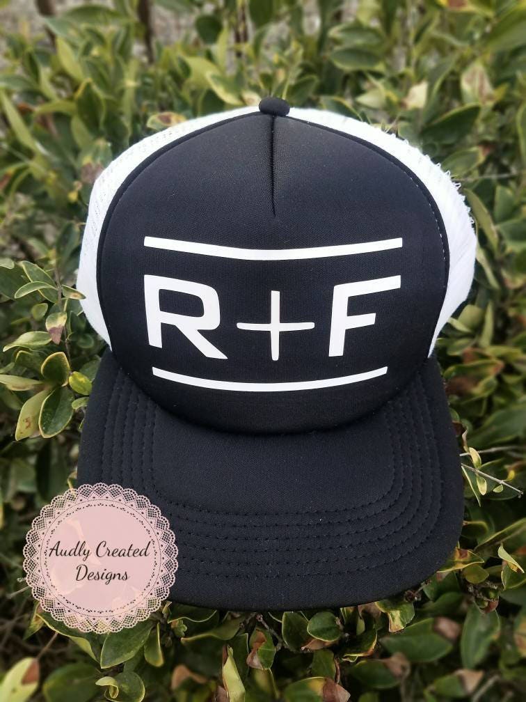 F Rodan & Fields Arrow Hat R