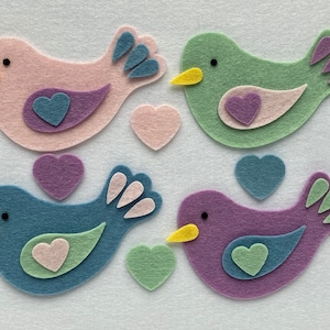 A set of felt bird shapes for crafts, four colours in a pack, perfect for sewing, card making and other craft projects.