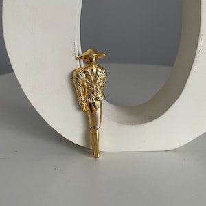 1950s gold tone female silhouette brooch