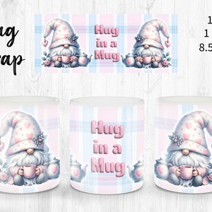 May include: A white ceramic mug wrap featuring a pink and blue plaid pattern with a gnome holding a mug. The gnome is wearing a pink hat with white hearts and has a white beard. The text "Hug in a Mug" is printed on the mug wrap.