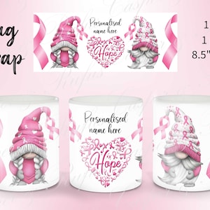 May include: A white ceramic mug wrap design featuring two pink gnomes with pink ribbons and a pink heart with the word "Hope" surrounded by pink ribbons. The text "Personalised name here" is also included.