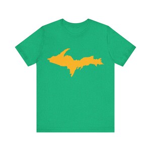 May include: A green t-shirt with a yellow outline of the Upper Peninsula of Michigan.
