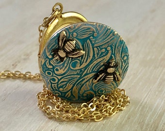 Blue Bee Locket with floral design customized with photos makes a great gift for a woman or little girl