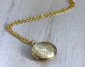 Small gold locket with photos makes a great gift for a little girl or petite woman