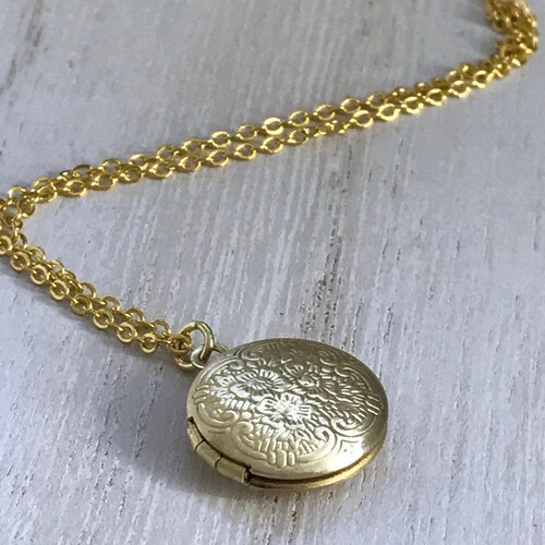 Small Gold Locket With Photos Makes a 