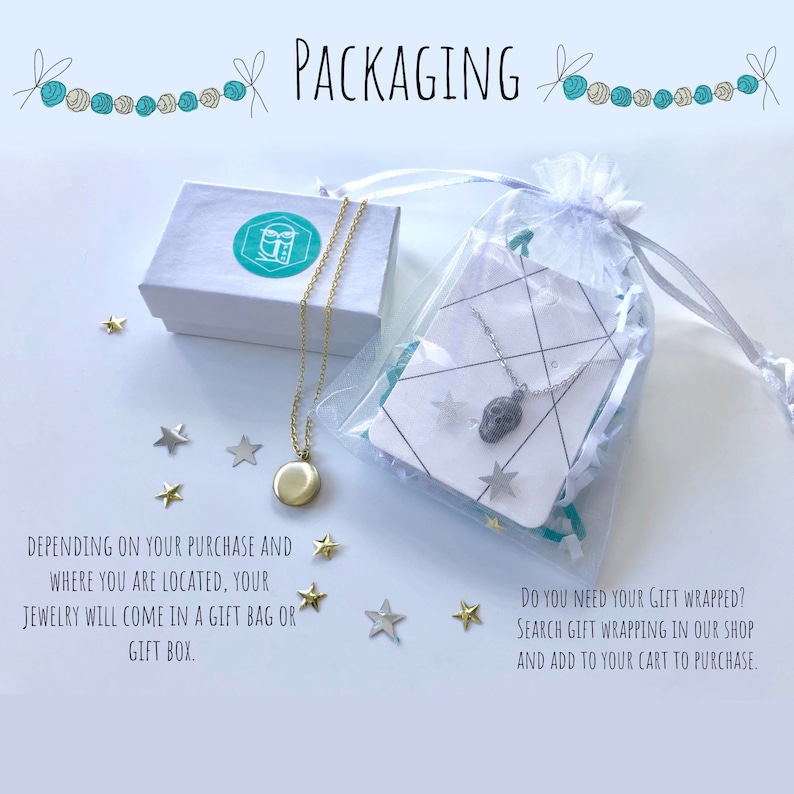 May include: A white gift box with a blue logo and a gold chain necklace with a round pendant. The necklace is packaged in a clear plastic bag with a white card and a silver chain necklace with a skull pendant. The text on the card reads "Do you need your gift wrapped? Search gift wrapping in our shop and add to your cart to purchase."