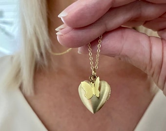 Heart shaped butterfly locket with photos