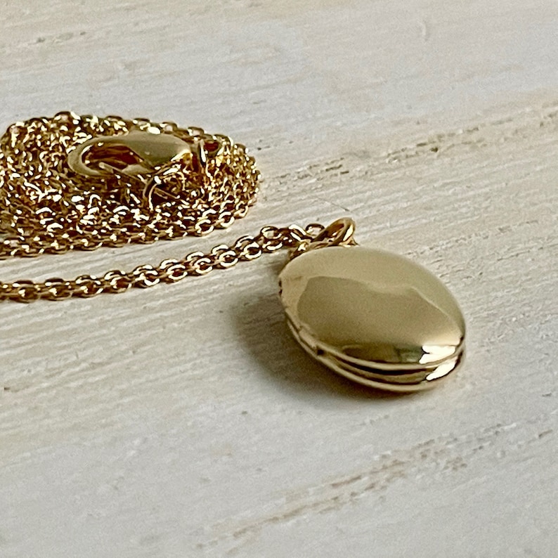 Tiny gold oval locket customized with photos minimalist and petite image 4