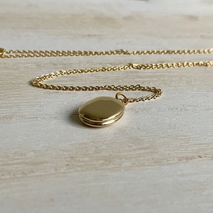 Tiny gold oval locket customized with photos minimalist and petite image 7