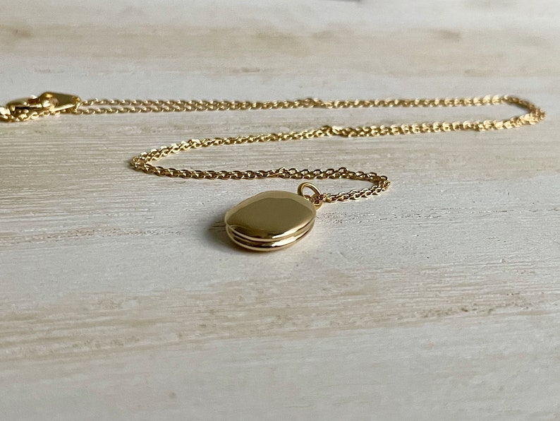 Tiny gold oval locket customized with photos minimalist and petite image 7