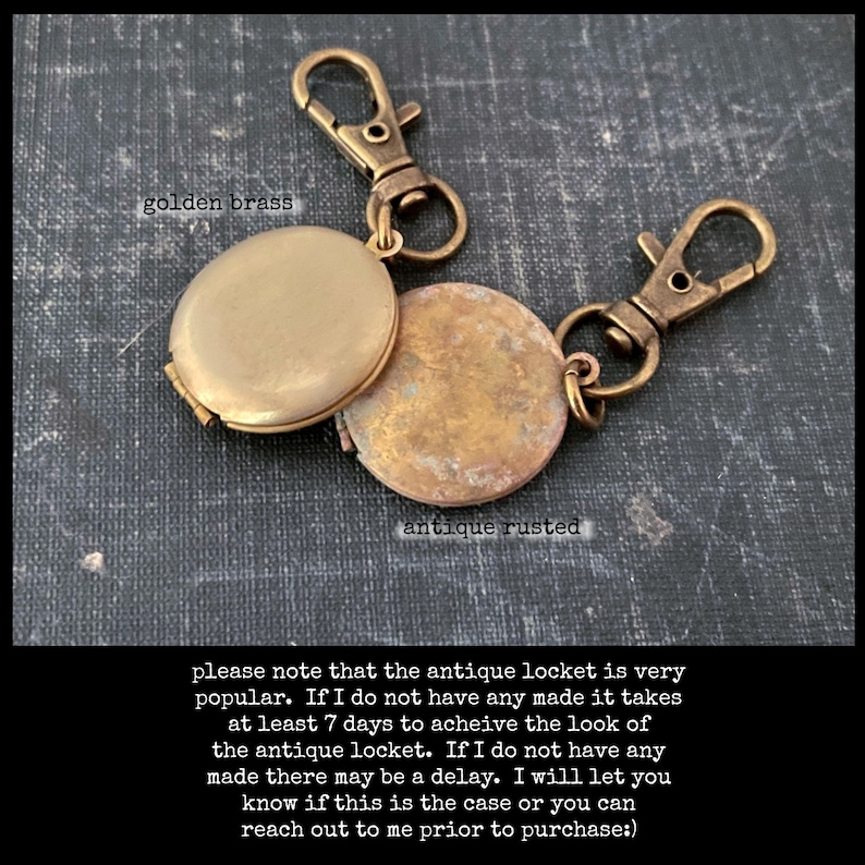 May include: A gold locket keychain with a golden brass finish and an antique rusted finish. The locket is open and the inside is visible. The keychain has two clasps. "Please note that the antique locket is very popular. If I do not have any made it takes at least 7 days to achieve the look of the antique locket. If I do not have any made there may be a delay. I will let you know if this is the case or you can reach out to me prior to purchase."