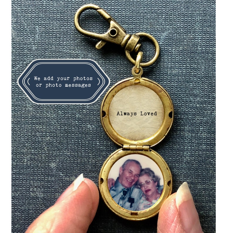 May include: Gold locket keychain with a photo of an older couple inside. The locket is open and the inside reads "Always Loved".