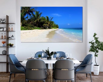 Lienzo decorativo de pared con temática playera, palmeras y puesta de sol sobre el océano, con bordes envueltos.
