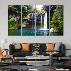 May include: A multi-panel canvas print featuring a waterfall cascading down a rocky cliff face, surrounded by lush green foliage. The water is a vibrant turquoise color, and the surrounding trees are a deep green.