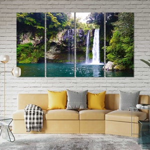 May include: A multi-panel canvas print featuring a waterfall cascading down a rocky cliffside, surrounded by lush green foliage. The water is a vibrant turquoise, and the scene is tranquil and serene.