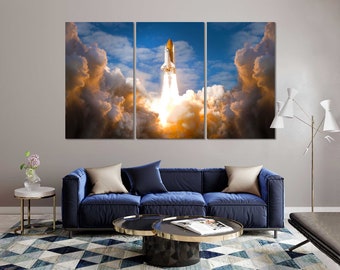 May include: A white space shuttle launches into a cloudy sky. The shuttle is surrounded by white smoke and clouds. The sky is blue with white clouds.