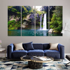 May include: A multi-panel canvas print featuring a lush green forest with a cascading waterfall flowing into a clear blue pool of water.