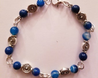 Blue swirl and silver beaded bracelet