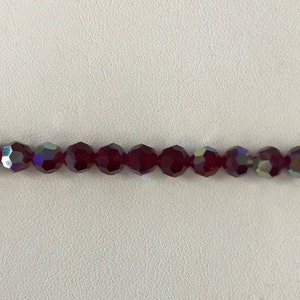 5000 Swarovski® 6mm Round - Siam AB - 12 pieces