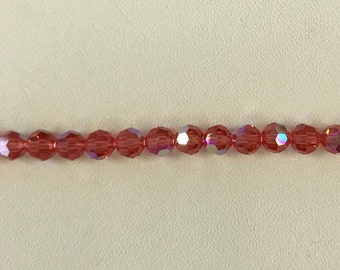 5000 Swarovski® 6mm Round - Padparadscha AB - 12 pieces