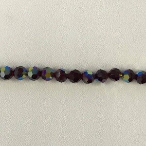 5000 Swarovski® 6mm Round - Garnet AB - 12 pieces