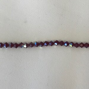 5301/5328 Swarovski® 4mm Bicone - Siam AB - 36 pieces