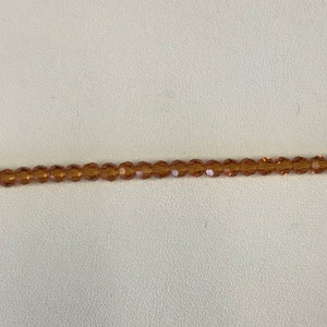 5000 Swarovski® 4mm Round - Topaz - 24 pieces