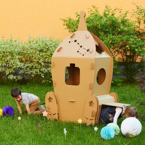 Personalized Cardboard Space Shuttle. Kids Spaceship Playhouse. Rocket playhouse. Creative Crafts Playhouse for kids. Best Toy for Children. Brown cardboard