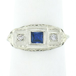 Antique Art Deco 14K White Gold 0.10ctw Old European Diamond & French Square Bezel Synthetic Sapphire w/ Open Filigree Work 3 Stone Ring