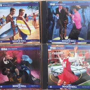 May include: Four CD cases featuring vintage artwork. The covers display scenes from the rock and roll era, including surfers, dancers, and a classic car. Each case has the text "The Rock 'N' Roll Era" and a year.