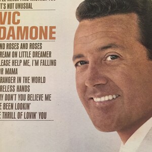 May include: A vintage vinyl record cover featuring a portrait of Vic Damone, a popular American singer. The cover is white with blue text that reads "You Were Only Foolin'" and lists the songs on the record: "I'll Never Find Another You", "It's Not Unusual", "And Roses And Roses", "Dream On Little Dreamer", "Please Help Me, I'm Falling", "For Mama", "Stranger In The World", "Reless Hands", "Why Don't You Believe Me", "I've Been Lookin'", "The Thrill Of Lovin' You".