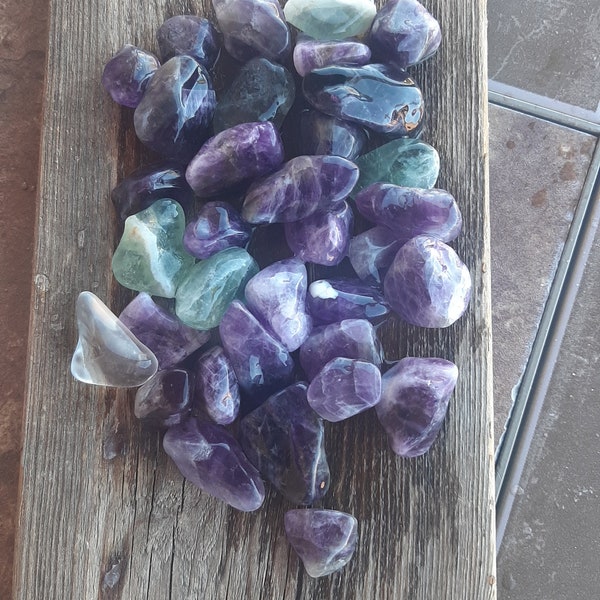 Tumbler rocks, green and purple stones, amethyst and flourite lightly polished stones.