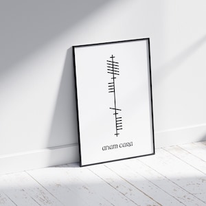 Side view of an A4 black frame featuring Anam Cara (Soulmate) text beneath Ogham script. Black lettering on a white modern minimalist background.