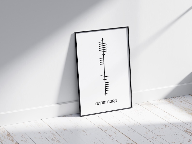 Side view of an A4 black frame featuring Anam Cara (Soulmate) text beneath Ogham script. Black lettering on a white modern minimalist background.