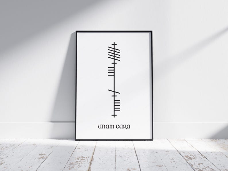 Anam Cara (Soulmate) text below Ogham script that translates to Anam Cara, Irish for Soulmate. Black Ogham lettering and text on a clean white modern background, displayed in an A4 black frame mock-up.
