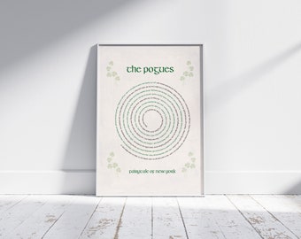 May include: A white framed print with a green and white spiral design featuring the text "the Pogues" and "Fairytale of New York".
