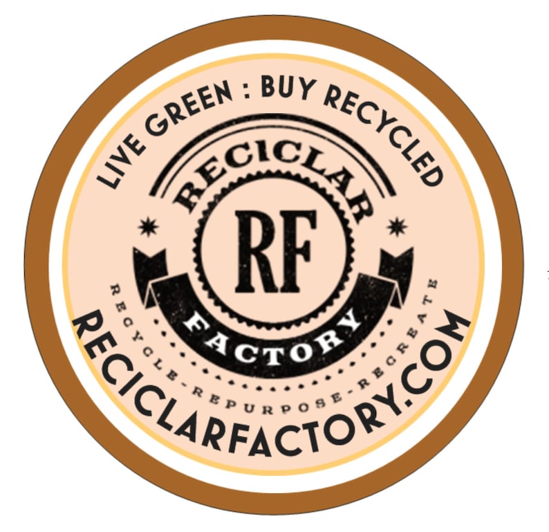May include: A brown and white circular sticker with the text "Live Green: Buy Recycled" and "Reciclarfactory.com". The centre of the sticker features a black and white logo with the text "Reciclar RF Factory Recycle Repurpose Recreate"